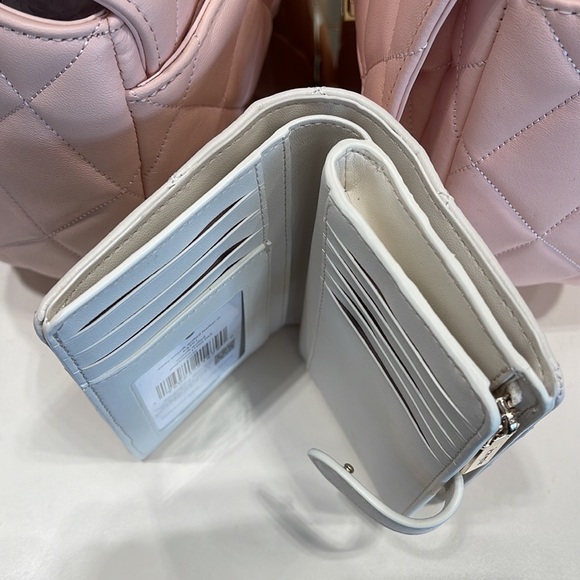 Kate Spade Carey Medium Compartment Bifold Wallet 
COLOR: Parchment - Picture 12 of 16